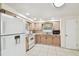 Fully-equipped kitchen with white appliances and ample cabinet storage at 3324 W Saint Joseph St, Tampa, FL 33607