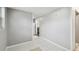 Bright living room featuring tile flooring and neutral walls at 3324 W Saint Joseph St, Tampa, FL 33607