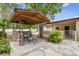 Outdoor patio features a covered dining area with a built-in grill, perfect for entertaining and enjoying the weather at 3324 W Saint Joseph St, Tampa, FL 33607