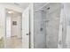 Shower with gray tiles and a shower curtain in a bright bathroom at 3324 W Saint Joseph St, Tampa, FL 33607
