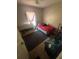 Simple bedroom with a window, carpet flooring, and basic furnishings at 3710 N 57Th St, Tampa, FL 33619