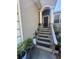 Inviting front porch with classic columns and stairs to the front door at 3710 N 57Th St, Tampa, FL 33619