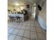 View of the kitchenette and entry way of the home with tile floors at 3710 N 57Th St, Tampa, FL 33619