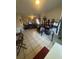 Open living space with tile floors, and a partial view of the living room area at 3710 N 57Th St, Tampa, FL 33619