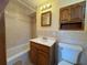 Bathroom featuring a vanity, medicine cabinet, toilet, and tiled shower-tub combo at 3762 18Th S Ter, St Petersburg, FL 33711