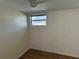 Cozy bedroom featuring a window, neutral paint, and wood-look flooring providing a clean and comfortable space at 3762 18Th S Ter, St Petersburg, FL 33711
