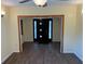 Entryway with wood look flooring, door with glass accents, and access to other rooms at 3762 18Th S Ter, St Petersburg, FL 33711