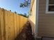 Side yard with new wooden fence and recently mowed ground ready to plant a garden at 3762 18Th S Ter, St Petersburg, FL 33711