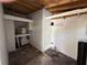 Functional utility room with water heater, storage shelves, and concrete floors, providing practical space at 3762 18Th S Ter, St Petersburg, FL 33711