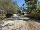 Fenced in yard, home is light colored and has trees for added privacy and shade at 3762 18Th S Ter, St Petersburg, FL 33711