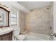 Updated bathroom featuring tiled shower and tub and vanity at 3929 Cochise Ter, Sarasota, FL 34233