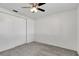 Bedroom featuring neutral carpet, a ceiling fan, and closet at 3929 Cochise Ter, Sarasota, FL 34233
