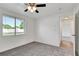 Bright bedroom with carpet floors, white walls, and a window with blinds at 3929 Cochise Ter, Sarasota, FL 34233