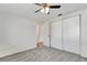 Bright bedroom with carpet floors, white walls, and a double closet at 3929 Cochise Ter, Sarasota, FL 34233
