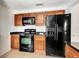 Efficient kitchen with matching appliances, ample cabinet space, and sleek countertops at 3929 Cochise Ter, Sarasota, FL 34233