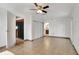 View of the spacious room with tile flooring, ceiling fan, closets and entryways to the kitchen and bathroom at 3929 Cochise Ter, Sarasota, FL 34233