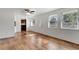 Inviting open concept living area flows into the kitchen with sleek flooring and ample sunlight at 3929 Cochise Ter, Sarasota, FL 34233