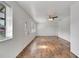 Spacious living room with wood floors, neutral paint, and multiple windows to let in sunlight at 3929 Cochise Ter, Sarasota, FL 34233