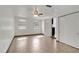 Bright living room featuring tile flooring, a ceiling fan and white walls, creating a clean and inviting space at 3929 Cochise Ter, Sarasota, FL 34233