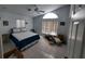Bedroom with lots of light, a fan and tile flooring at 5025 Westshore Dr, New Port Richey, FL 34652