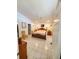 Neutral bedroom featuring a ceiling fan, lighting, and ceramic tile floors at 5025 Westshore Dr, New Port Richey, FL 34652