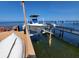 Waterfront boat dock with boat lift system for easy access to the water at 5025 Westshore Dr, New Port Richey, FL 34652