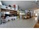 Open-concept living area and kitchen with tile floors and lots of natural light at 5025 Westshore Dr, New Port Richey, FL 34652
