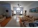 Open-concept living area with vaulted ceiling, tile floor and lots of natural light at 5025 Westshore Dr, New Port Richey, FL 34652