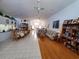 Bright, open-concept living and dining area featuring wood floors and tile flooring at 5025 Westshore Dr, New Port Richey, FL 34652
