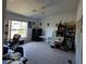 Office area with desk, chair, lots of natural light, and ceramic tile flooring at 5025 Westshore Dr, New Port Richey, FL 34652