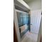 Bathroom shower with glass sliding doors and a plush white bath mat at 5025 Westshore Dr, New Port Richey, FL 34652