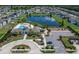 Aerial view of the community showcasing a lake, pool, playground, and clubhouse at 5043 White Chicory Dr, Apollo Beach, FL 33572