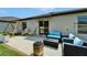 Paver patio with comfortable seating and a fire pit, perfect for outdoor entertaining at 5043 White Chicory Dr, Apollo Beach, FL 33572