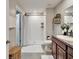 Bright bathroom features tiled shower, vanity with granite countertop and decor at 5043 White Chicory Dr, Apollo Beach, FL 33572
