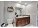 Bathroom boasts double sinks with granite countertop, vanity, and large mirror at 5043 White Chicory Dr, Apollo Beach, FL 33572