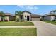 Charming single-story home features a well-manicured lawn and inviting curb appeal in a great neighborhood at 5043 White Chicory Dr, Apollo Beach, FL 33572