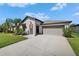 Charming single-story home with a well-maintained lawn and inviting curb appeal at 5043 White Chicory Dr, Apollo Beach, FL 33572