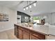 Stylish kitchen with granite countertops, stainless steel appliances, and modern lighting at 5043 White Chicory Dr, Apollo Beach, FL 33572