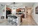 Modern kitchen featuring an island with seating, granite countertops, and stainless steel appliances at 5043 White Chicory Dr, Apollo Beach, FL 33572