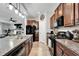 Well-equipped kitchen with granite countertops, stainless steel appliances, and ample cabinet space at 5043 White Chicory Dr, Apollo Beach, FL 33572