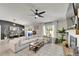 Inviting living room with a spacious sectional, stylish coffee table, and access to the backyard at 5043 White Chicory Dr, Apollo Beach, FL 33572