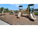Community playground with slides and climbing structures, perfect for families at 5043 White Chicory Dr, Apollo Beach, FL 33572