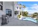 Outdoor patio and pool area with lush landscaping and waterfront views at 5212 62Nd S Ave, St Petersburg, FL 33715