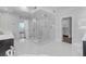 Bright bathroom with large glass shower, dual shower heads, and white tile flooring at 5212 62Nd S Ave, St Petersburg, FL 33715