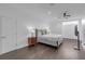 Neutral toned bedroom with a bed, minimalist bedside table and sleek TV on the wall at 5212 62Nd S Ave, St Petersburg, FL 33715