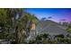 Stunning two-story home featuring an arched entry and lush tropical landscaping at 5212 62Nd S Ave, St Petersburg, FL 33715