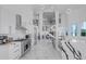Spacious open kitchen with island, stainless appliances, and modern lighting at 5212 62Nd S Ave, St Petersburg, FL 33715