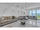 Spacious living room with multiple seating areas and elegant marble floors at 5212 62Nd S Ave, St Petersburg, FL 33715