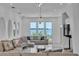 Bright living room with large windows showcasing water views and recessed lighting at 5212 62Nd S Ave, St Petersburg, FL 33715