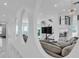 Open-concept living room featuring unique architectural wall cut-outs and marble flooring at 5212 62Nd S Ave, St Petersburg, FL 33715